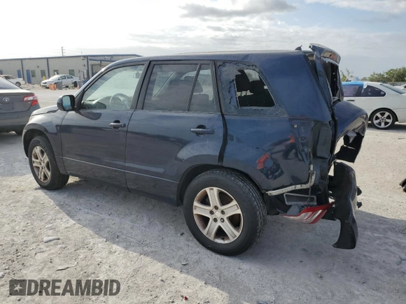 2012 Suzuki Grand Vitara Premium z VIN JS3TD0D29C4100139, wystawiony jako Copart lot #49163115 z przebiegiem 271 080 mil mil oraz Nie do naprawy. Historia ofert i sprzedaży dostępna na DreamBid. Obrazek 2.