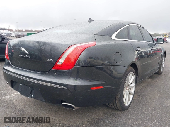 2014 Jaguar XJ with VIN SAJWA1CZ0E8V73966, listed as a IAAI auction lot 41887234 with 120,804 mi miles and . Bid and sale history available at DreamBid. Image 4.