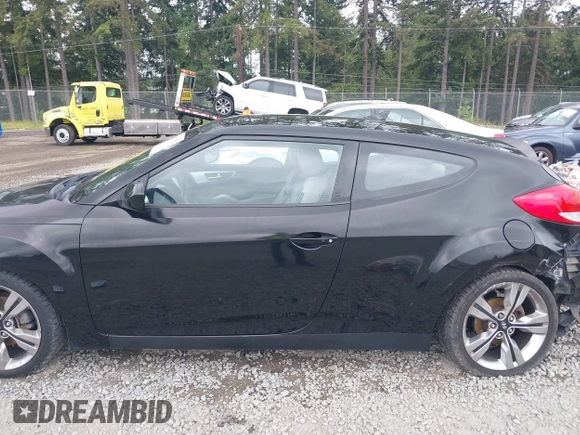 2012 Hyundai Veloster w/Gray Int with VIN KMHTC6AD4CU062034, listed as a IAAI auction lot 42371790 with 116,861 mi miles and . Bid and sale history available at DreamBid. Image 14.