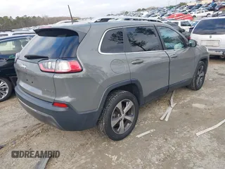 2020 Jeep Cherokee Limited with VIN 1C4PJLDBXLD502858, listed as a IAAI auction lot 41148184 with 73,509 mi miles. Bid and sale history available at carsss.com. Image 4.