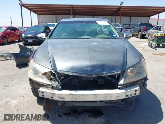 2005 Acura RL z VIN JH4KB16505C012679, wystawiony jako IAAI lot #41976411 z przebiegiem 103 342 mil mil oraz . Historia ofert i sprzedaży dostępna na DreamBid. Obrazek 13.