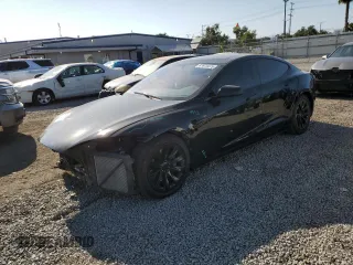 2016 Tesla Model S 90D with VIN 5YJSA1E20GF169954, listed as a Copart auction lot 61974475 with 124,560 mi miles and Salvage title. Bid and sale history available at DreamBid. Image 1.