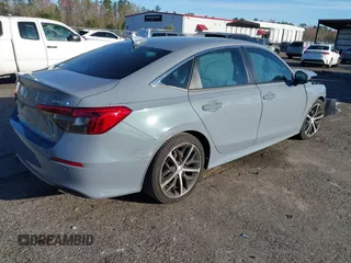 2024 Honda Civic Sedan Touring with VIN 2HGFE1F9XRH308973, listed as a IAAI auction lot 41643985 with 5,842 mi miles. Bid and sale history available at carsss.com. Image 4.