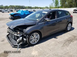 2016 Ford Focus Titanium with VIN 1FADP3N27GL201482, listed as a Copart auction lot 51768335 with 54,463 mi miles and Salvage title. Bid and sale history available at DreamBid. Image 1.