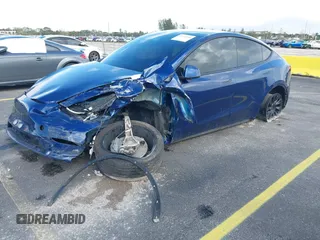 2021 Tesla Model Y Standard Range with VIN 5YJYGDED4MF112857, listed as a IAAI auction lot 41134600 with Not Provided miles and . Bid and sale history available at DreamBid. Image 2.