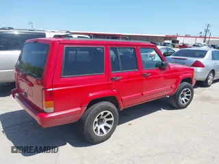 1998 Jeep Cherokee Sport with VIN 1J4FT68S2WL256846, listed as a IAAI auction lot 41998490 with 198,936 mi miles. Bid and sale history available at carsss.com. Image 4.