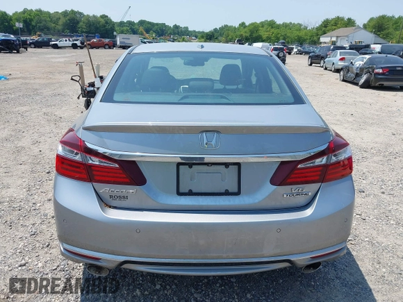 2017 Honda Accord Touring z VIN 1HGCR3F96HA001865, wystawiony jako IAAI lot #42424296 z przebiegiem 170 567 mil mil oraz . Historia ofert i sprzedaży dostępna na DreamBid. Obrazek 16.