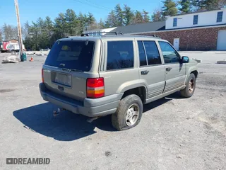1997 Jeep Grand Cherokee Laredo with VIN 1J4GZ58S7VC713517, listed as a IAAI auction lot 42062214 with 205,533 mi miles. Bid and sale history available at carsss.com. Image 4.