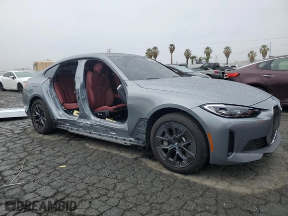 2023 BMW i4 eDrive40 with VIN WBY73AW08PFR23464, listed as a Copart auction lot 43525124 with 6,596 mi miles. Bid and sale history available at carsss.com. Image 4.