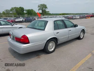 1999 Mercury Grand Marquis LS z VIN 2MEFM75W7XX659031, wystawiony jako IAAI lot #42362387 z przebiegiem 140 067 mil mil oraz . Historia ofert i sprzedaży dostępna na DreamBid. Obrazek 4.