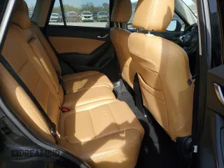 2016 Mazda CX-5 Touring z VIN JM3KE4CY0G0667171, wystawiony jako Copart lot #51579005 z przebiegiem 39 487 mil mil oraz Szkoda całkowita • Salvage title. Historia ofert i sprzedaży dostępna na DreamBid. Obrazek 11.