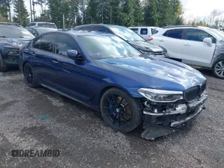 2018 BMW 5 Series M550i xDrive with VIN WBAJB9C55JB049773, listed as a IAAI auction lot 41861011 with 51,906 mi miles. Bid and sale history available at carsss.com. Image 1.