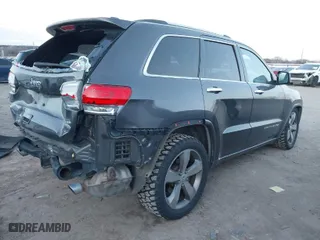 2014 Jeep Grand Cherokee Overland with VIN 1C4RJFCT8EC380899, listed as a IAAI auction lot 41372034 with 140,413 mi miles. Bid and sale history available at carsss.com. Image 4.
