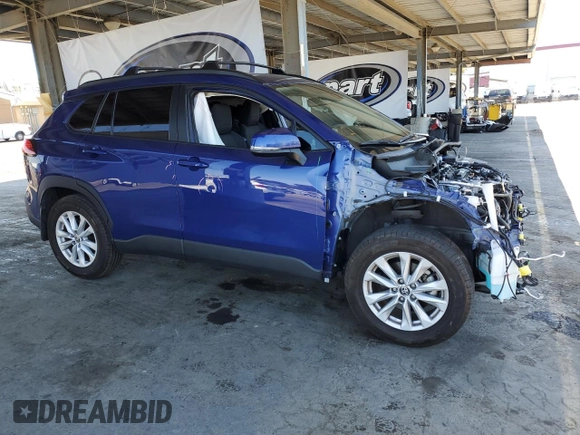 2022 Toyota Corolla Cross LE with VIN 7MUCAAAG6NV021103, listed as a Copart auction lot 56882015 with 21,769 mi miles and Salvage title. Bid and sale history available at DreamBid. Image 4.