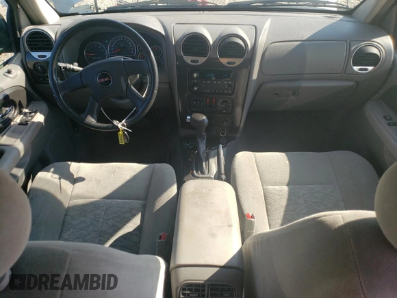 2005 GMC Envoy SLE z VIN 1GKDT13S552122428, wystawiony jako Copart lot #68651224 z przebiegiem 111 931 mil mil oraz Szkody całkowita. Historia ofert i sprzedaży dostępna na DreamBid. Obrazek 8.