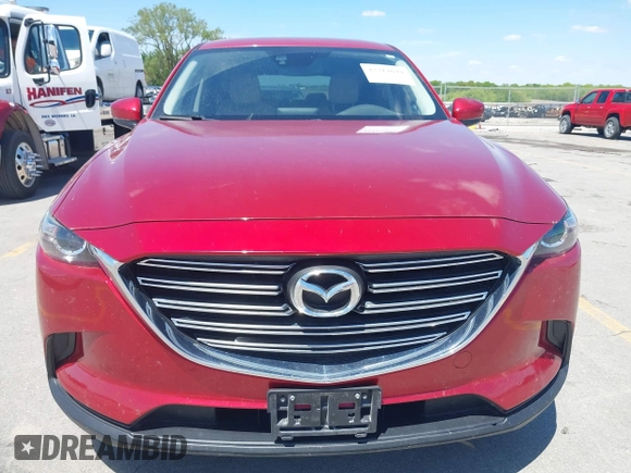 2016 Mazda CX-9 Touring with VIN JM3TCBCY5G0104504, listed as a IAAI auction lot 42314649 with 116,536 mi miles and . Bid and sale history available at DreamBid. Image 12.