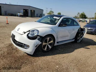 2012 Volkswagen Beetle 2.0T Turbo w/Sun/Sound with VIN 3VWV67AT5CM658403, listed as a Copart auction lot 71611614 with 10,878 mi miles and Salvage Title. Bid and sale history available at carsss.com. Image 1.