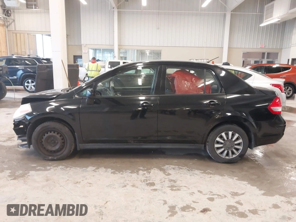 2009 Nissan Versa 1.8 S with VIN 3N1BC11E99L438342, listed as a IAAI auction lot 41561812 with 152,141 mi miles. Bid and sale history available at carsss.com. Image 15.