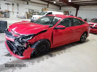 2021 Honda Civic LX z VIN 2HGFC2F69MH512979, wystawiony jako Copart lot #56468225 z przebiegiem 135 961 mil mil oraz Szkoda całkowita • Salvage title. Historia ofert i sprzedaży dostępna na DreamBid. Obrazek 1.