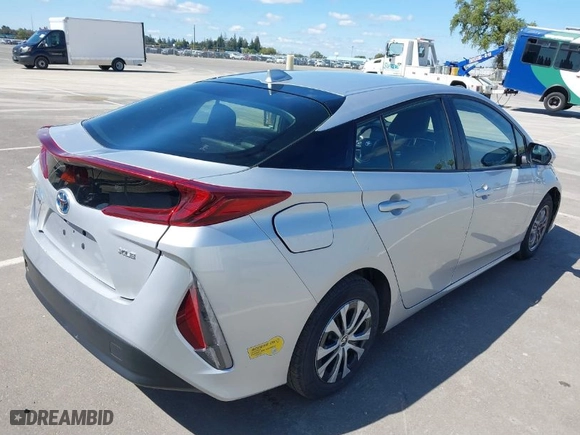 2021 Toyota Prius Prime LE with VIN JTDKAMFP4M3175051, listed as a IAAI auction lot 41856383 with 106,642 mi miles. Bid and sale history available at carsss.com. Image 4.