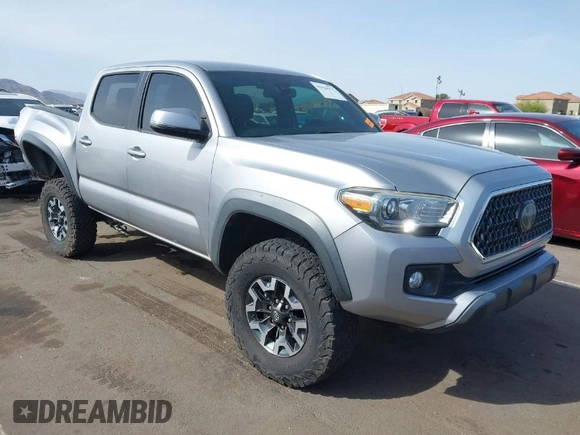 2018 Toyota Tacoma SR5 with VIN 3TMAZ5CN0JM053861, listed as a IAAI auction lot 41920377 with 104,015 mi miles and . Bid and sale history available at DreamBid. Image 1.