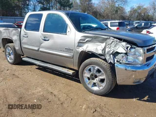 2013 Chevrolet Silverado 1500 LT with VIN 3GCPCSE06DG233909, listed as a IAAI auction lot 41601589 with 328,365 mi miles. Bid and sale history available at carsss.com. Image 1.