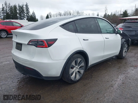 2021 Tesla Model Y Standard Range with VIN 5YJYGDED3MF103499, listed as a IAAI auction lot 41632064 with 132,846 mi miles and . Bid and sale history available at DreamBid. Image 4.
