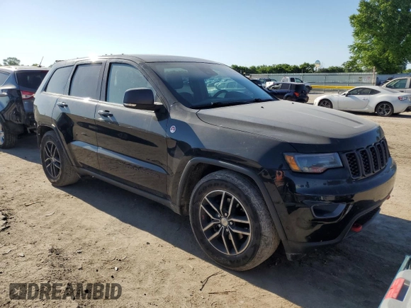 2017 Jeep Grand Cherokee Trailhawk with VIN 1C4RJFLG3HC881805, listed as a Copart auction lot 56471445 with 122,843 mi miles and Salvage title. Bid and sale history available at DreamBid. Image 4.