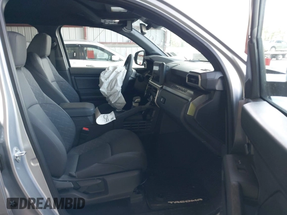 2025 Toyota Tacoma SR with VIN 3TMLB5JN7SM100983, listed as a IAAI auction lot 42220559 with 2,119 mi miles and . Bid and sale history available at DreamBid. Image 5.