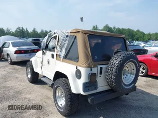 2002 Jeep Wrangler Sahara with VIN 1J4FA59S92P734763, listed as a IAAI auction lot 42411004 with 188,213 mi miles and . Bid and sale history available at DreamBid. Image 3.