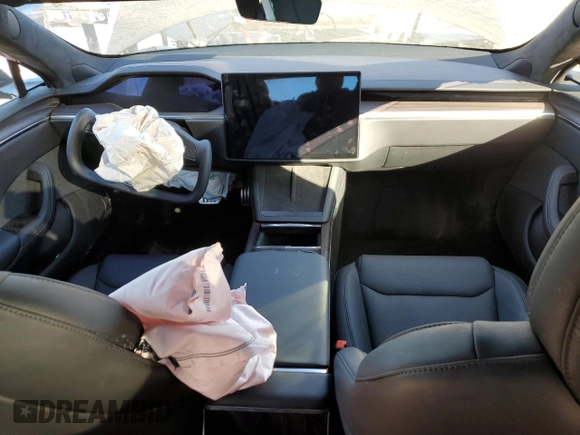2023 Tesla Model S with VIN 5YJSA1E5XPF519570, listed as a Copart auction lot 80573863 with Not provided miles and Salvage title. Bid and sale history available at DreamBid. Image 8.