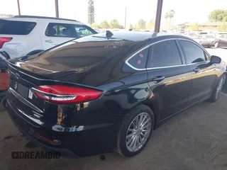 2020 Ford Fusion Titanium with VIN 3FA6P0RU8LR141324, listed as a IAAI auction lot 42004026 with 107,136 mi miles and . Bid and sale history available at DreamBid. Image 4.