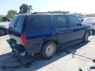1999 Chevrolet Tahoe with VIN 1GNEC13R7XJ573387, listed as a IAAI auction lot 42001191 with 241,007 mi miles. Bid and sale history available at carsss.com. Image 4.