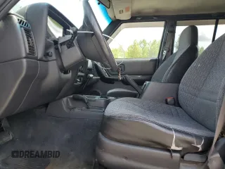 1999 Jeep Cherokee Sport with VIN 1J4FF68S2XL570795, listed as a Copart auction lot 61860585 with 320,467 mi miles and Salvage title. Bid and sale history available at DreamBid. Image 7.