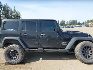 2015 Jeep Wrangler Unlimited Willys Wheeler with VIN 1C4BJWDG9FL750049, listed as a IAAI auction lot 42136188 with 115,328 mi miles and . Bid and sale history available at DreamBid. Image 14.