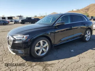 2019 Audi e-tron Premium Plus with VIN WA1LAAGE5KB023079, listed as a Copart auction lot 64977463 with 14,043 mi miles. Bid and sale history available at carsss.com. Image 1.