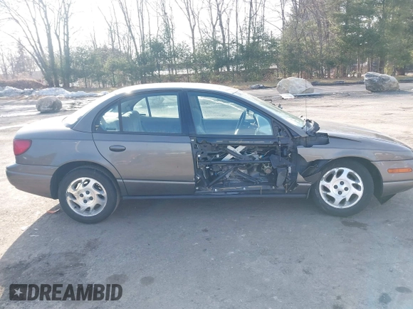 2000 Saturn SL z VIN 1G8ZK5275YZ244530, wystawiony jako IAAI lot #41784896 z przebiegiem 50 332 mil mil oraz . Historia ofert i sprzedaży dostępna na DreamBid. Obrazek 18.