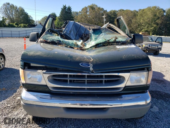 1999 Ford Econoline Passenger XL with VIN 1FBSS31L0XHB12679, listed as a Copart auction lot 74257504 with 136,821 mi miles and Salvage Title. Bid and sale history available at DreamBid. Image 5.