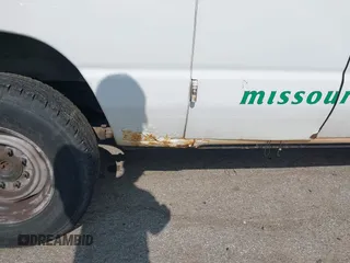 2013 Ford Econoline Cargo Commercial with VIN 1FTNE2EWXDDA52072, listed as a IAAI auction lot 42523635 with 262,097 mi miles and . Bid and sale history available at DreamBid. Image 6.