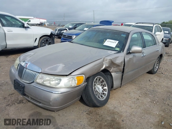 2001 Lincoln Town Car Signature with VIN 1LNHM82W21Y684197, listed as a IAAI auction lot 41944429 with 159,297 mi miles and . Bid and sale history available at DreamBid. Image 19.