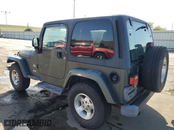 2003 Jeep Wrangler Sahara z VIN 1J4FA59SX3P302622, wystawiony jako Copart lot #52756105 z przebiegiem 181 900 mil mil oraz Szkoda całkowita • Salvage title. Historia ofert i sprzedaży dostępna na DreamBid. Obrazek 2.