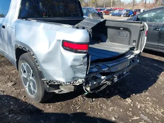 2022 Rivian R1T Adventure Package with VIN 7FCTGAAA1NN012328, listed as a IAAI auction lot 41307929 with 13,588 mi miles. Bid and sale history available at carsss.com. Image 6.