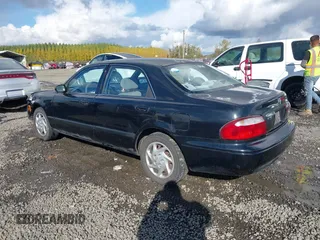 2000 Mazda 626 LX with VIN 1YVGF22CXY5123930, listed as a IAAI auction lot 40712369 with 210,234 mi miles. Bid and sale history available at carsss.com. Image 3.