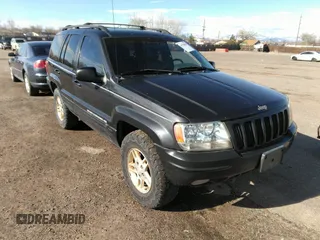 1999 Jeep Grand Cherokee Limited with VIN 1J4GW68N8XC770305, listed as a IAAI auction lot 41720558 with 206,180 mi miles. Bid and sale history available at carsss.com. Image 1.