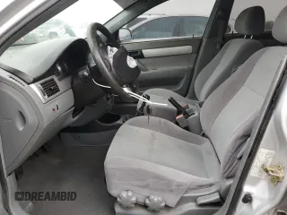 2006 Suzuki Forenza z VIN KL5JD56Z76K411376, wystawiony jako Copart lot #82751694 z przebiegiem Nie podano mil oraz Szkody całkowita. Historia ofert i sprzedaży dostępna na DreamBid. Obrazek 7.