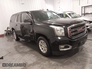 2016 GMC Yukon XL SLE with VIN 1GKS2FKC5GR173343, listed as a IAAI auction lot 41249784 with 122,446 mi miles. Bid and sale history available at carsss.com. Image 1.
