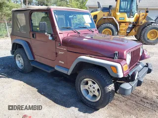 2002 Jeep Wrangler Sport with VIN 1J4FA49SX2P713303, listed as a IAAI auction lot 42136848 with 152,822 mi miles. Bid and sale history available at carsss.com. Image 1.