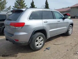 2014 Jeep Grand Cherokee Laredo with VIN 1C4RJFAG7EC243121, listed as a IAAI auction lot 41925695 with 147,999 mi miles. Bid and sale history available at carsss.com. Image 4.