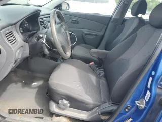 2009 Kia Rio LX with VIN KNADE223696530633, listed as a Copart auction lot 68371794 with 165,505 mi miles and Salvage Title. Bid and sale history available at carsss.com. Image 7.