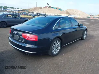 2011 Audi A8 with VIN WAURVAFD4BN018884, listed as a IAAI auction lot 42693000 with 116,952 mi miles and . Bid and sale history available at DreamBid. Image 4.